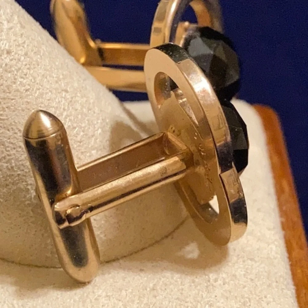 Vintage Swank gold tone cufflinks with faux onyx multifaceted gem